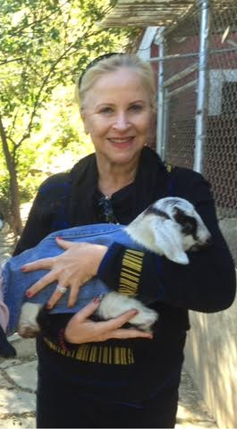 Larraine holding baby goat in denim Feb 2016